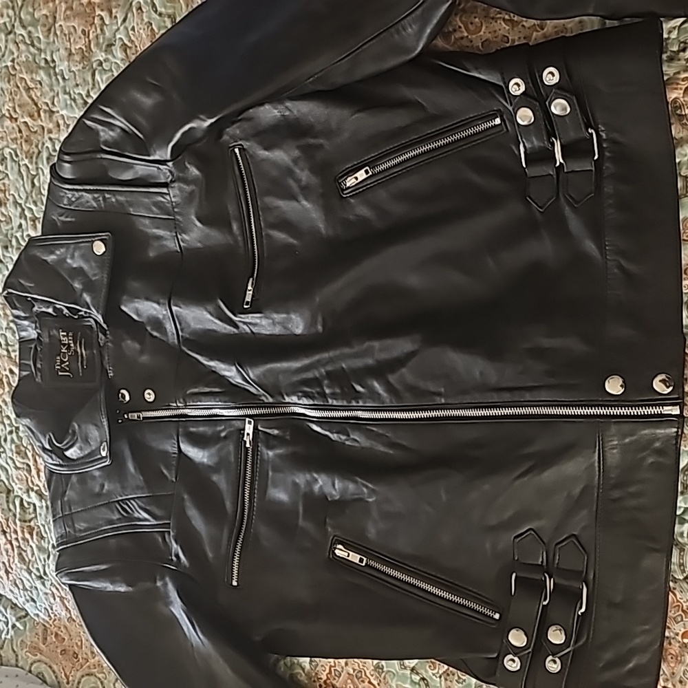 Black leather motorcycle jacket made by the jacket seller. New without tags.
